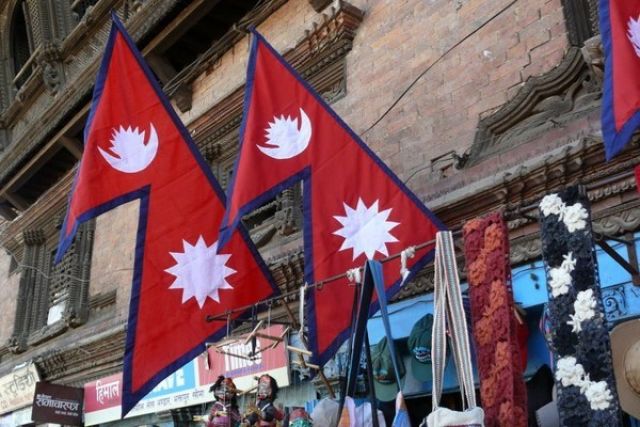 Стоковые фотографии Флаг Непала На Фоне Бумаги премиум-класса